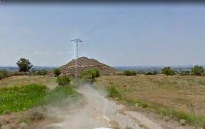 El Tossal del Pobre amb una línia elèctrica