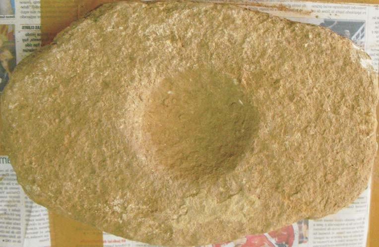 Pedra de molí amb una depressió circular al centre